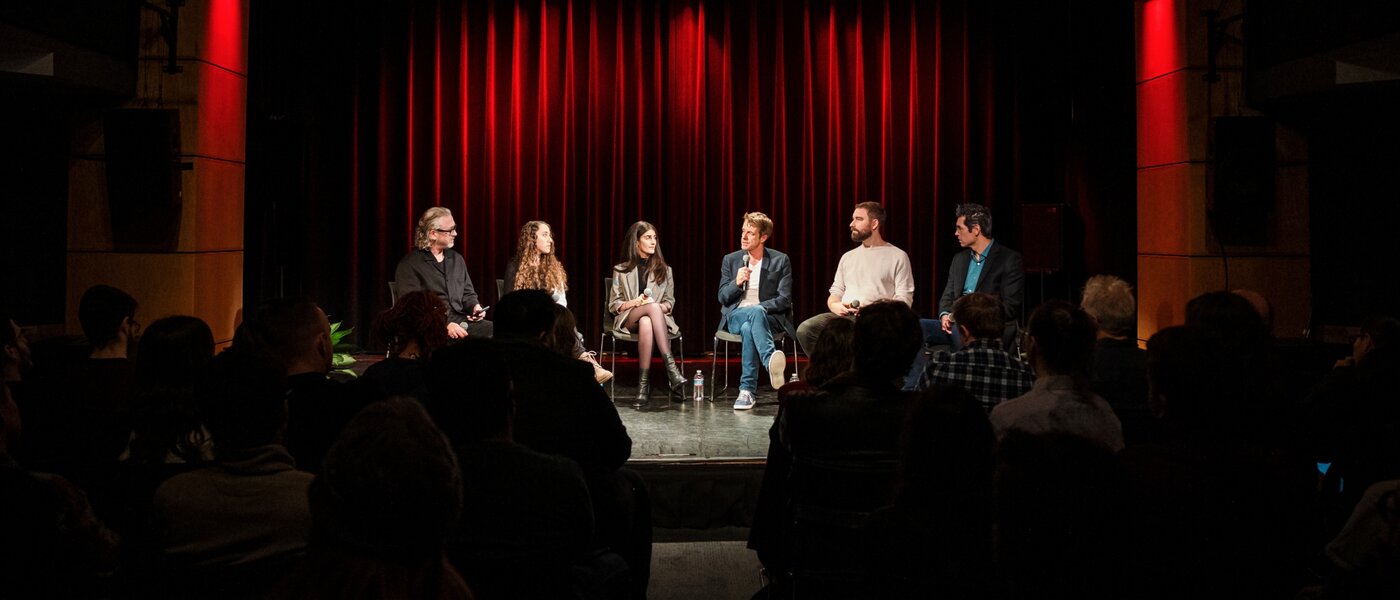 A group of people onstage discussing Orchestral Tools x Berklee